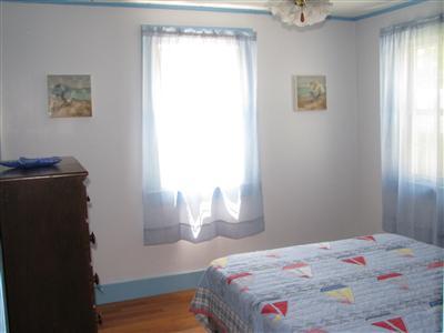 29 Bain Road Dennis Port, MA 02639 - Photo 17 of 21 a bedroom with a bed and a window