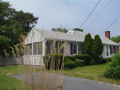 29 Bain Road Dennis Port, MA 02639 - Photo 2 of 21 a front view of a house with garden