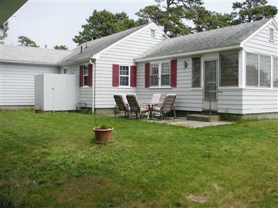 29 Bain Road Dennis Port, MA 02639 - Photo 5 of 21 a front view of a house with a garden