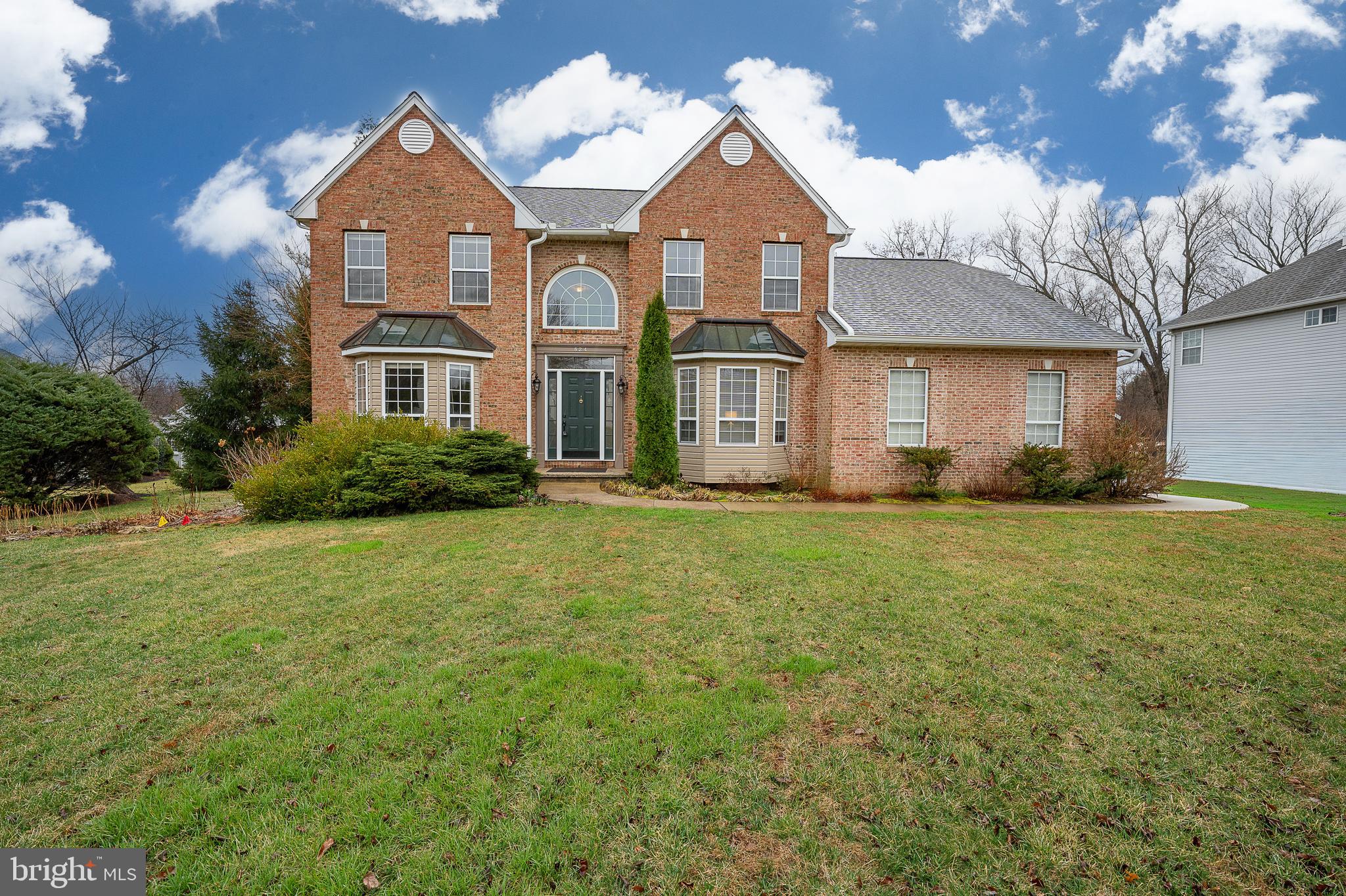 824 Waverly Road Kennett Square, PA 19348 - Photo 1 of 42 a front view of a house with a garden