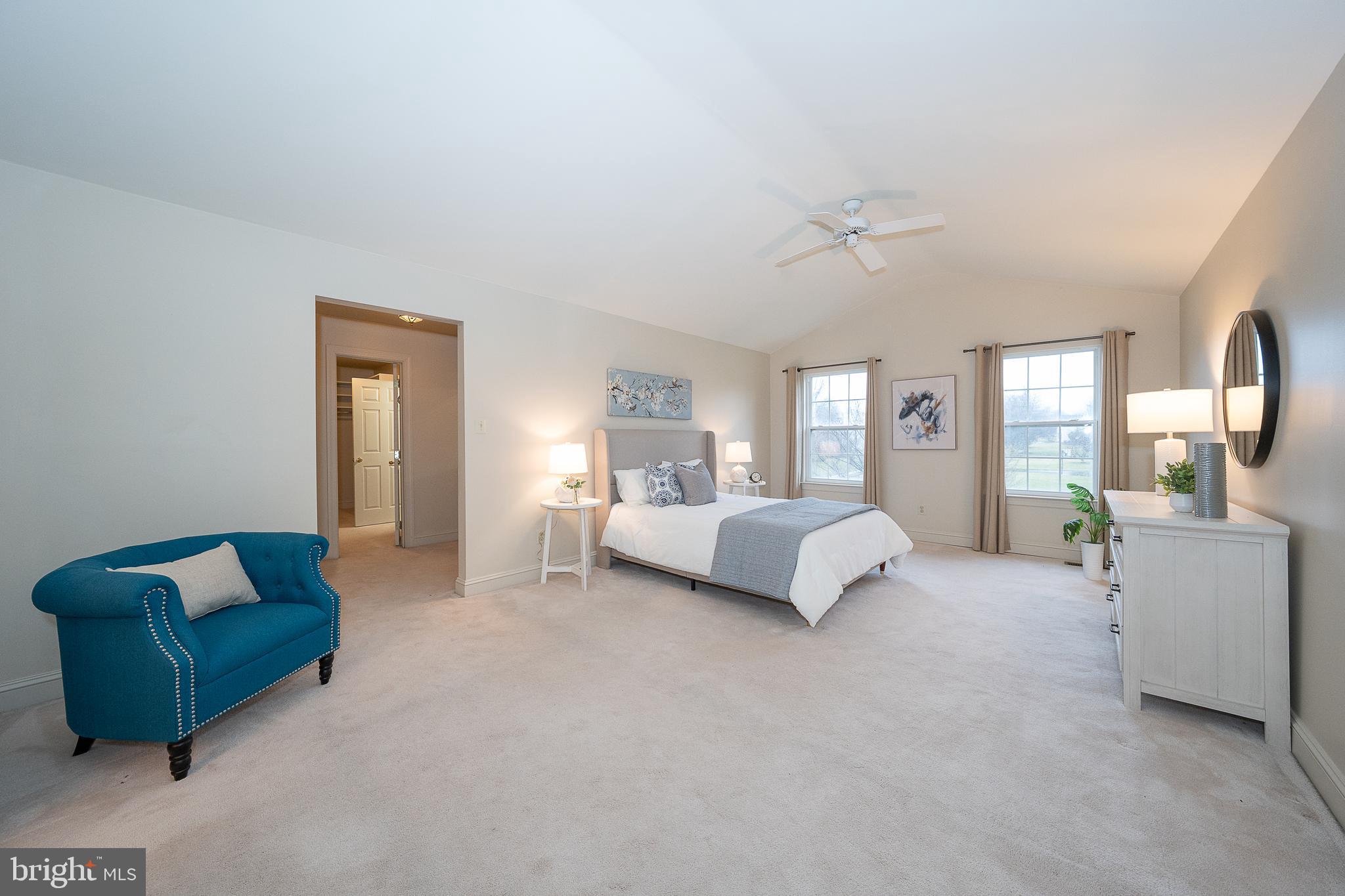 824 Waverly Road Kennett Square, PA 19348 - Photo 18 of 42 a spacious bedroom with a bed couch and window