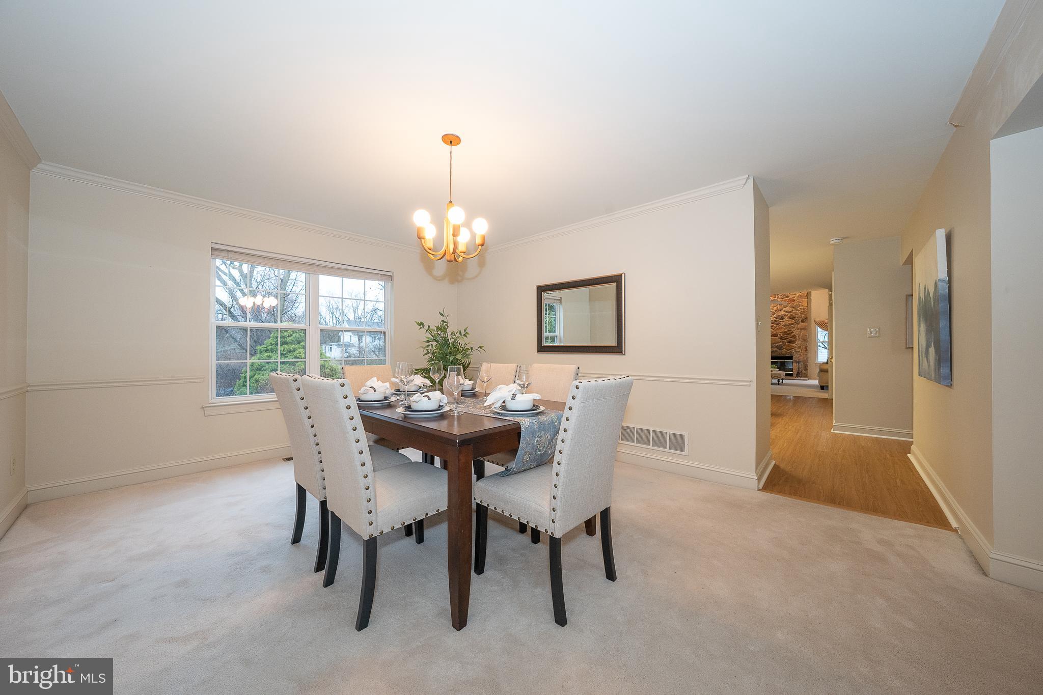 824 Waverly Road Kennett Square, PA 19348 - Photo 7 of 42 a view of a dining room with furniture and chandelier