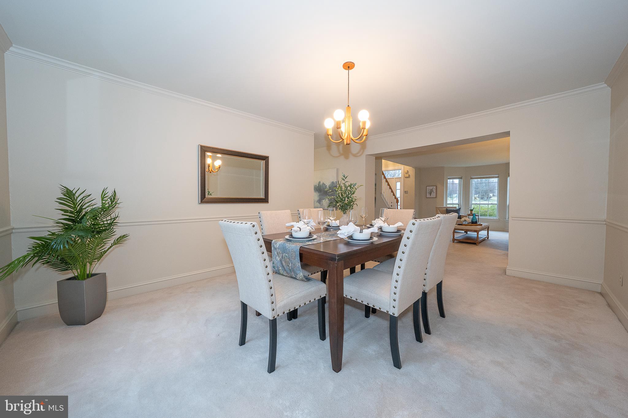 824 Waverly Road Kennett Square, PA 19348 - Photo 8 of 42 a dining room with furniture and chandelier