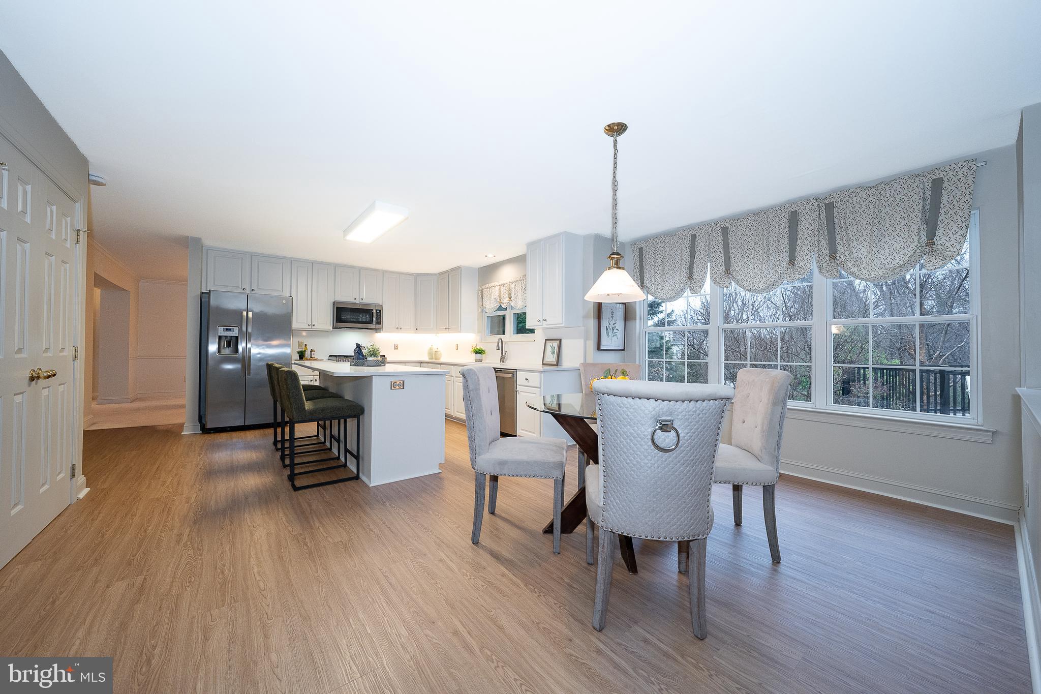 824 Waverly Road Kennett Square, PA 19348 - Photo 9 of 42 a view of a dining room with furniture window and wooden floor