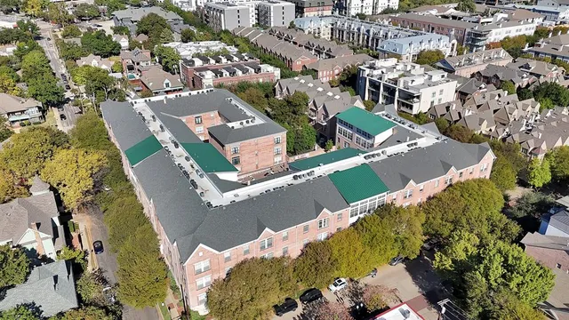 an aerial view of residential houses with outdoor space