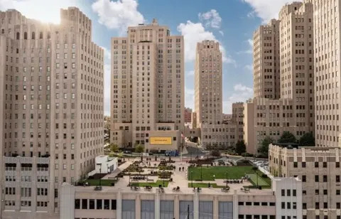 a view of city with tall buildings