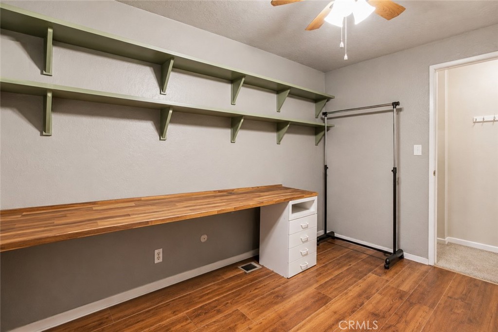 1908 Chelwood Way Modesto, CA 95355 - Photo 21 of 54 a room with wooden floor and chandelier