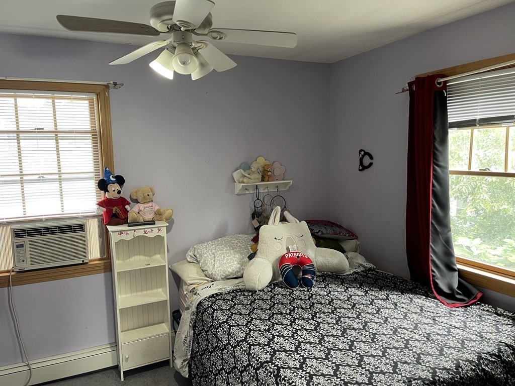 101 Wright Street Arlington, MA 02474 - Photo 15 of 18 a bedroom with a bed and a window