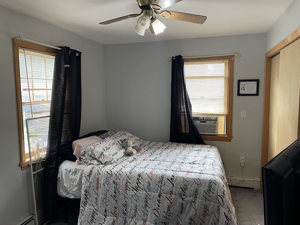 101 Wright Street Arlington, MA 02474 - Photo 16 of 18 a bedroom with a bed and a window