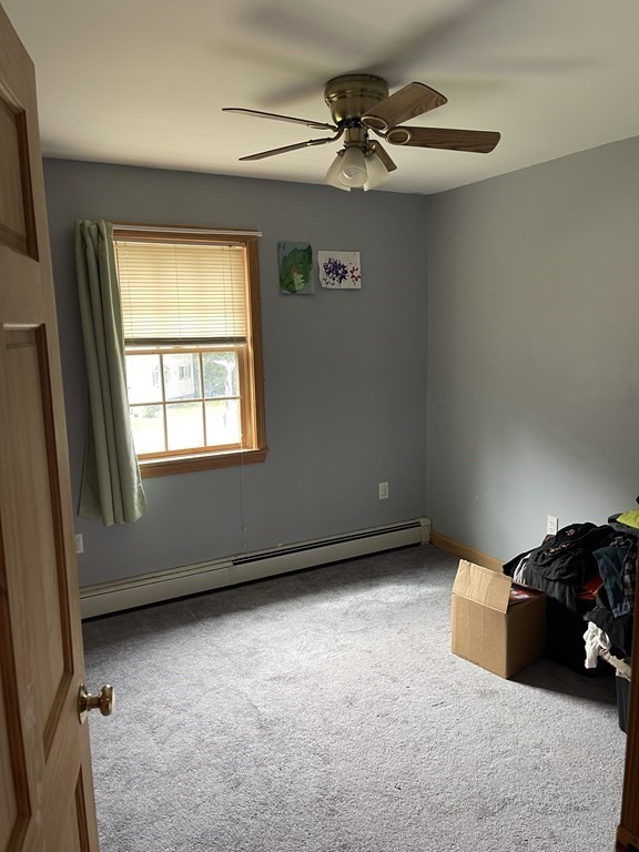 101 Wright Street Arlington, MA 02474 - Photo 18 of 18 a view of a livingroom with a ceiling fan and a window