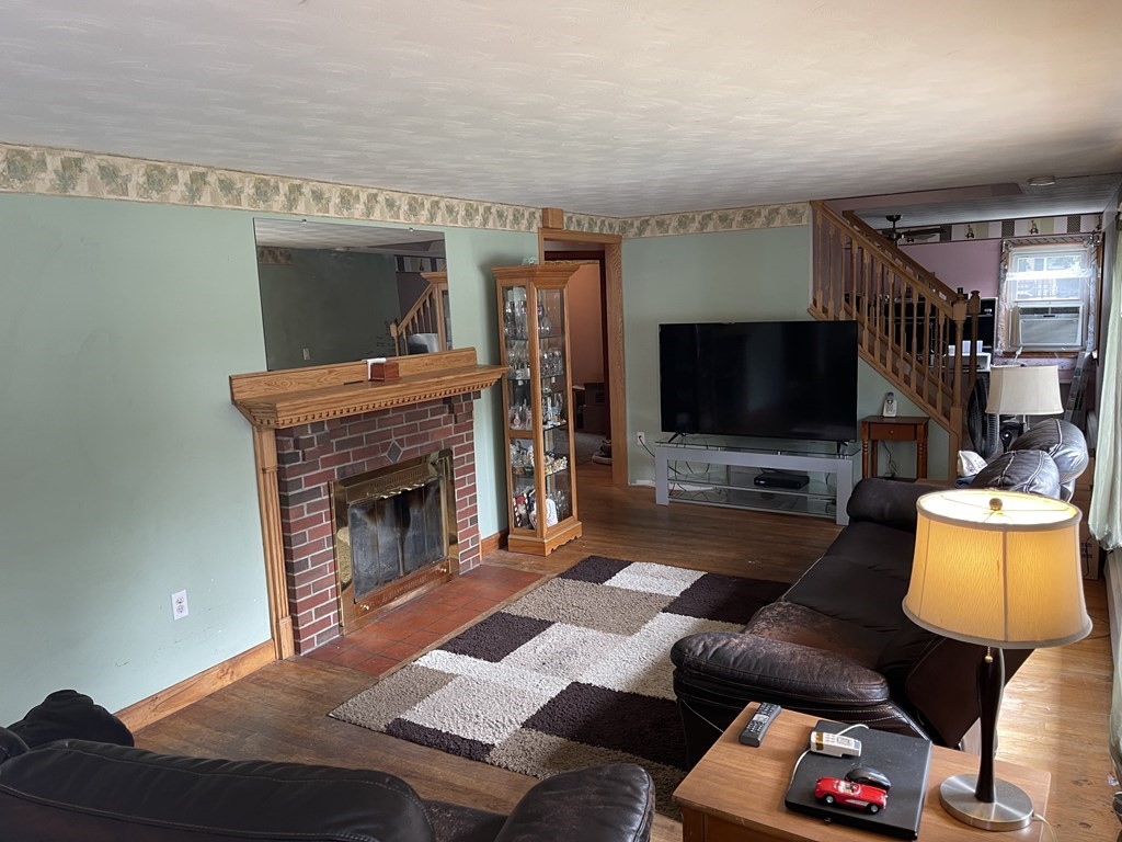 101 Wright Street Arlington, MA 02474 - Photo 6 of 18 a living room with furniture and a flat screen tv