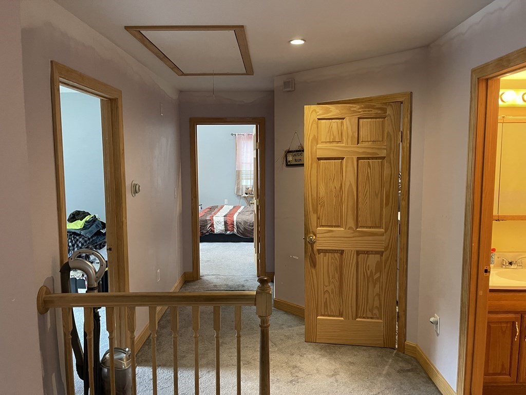 101 Wright Street Arlington, MA 02474 - Photo 10 of 18 a view of a hallway and a livingroom with furniture