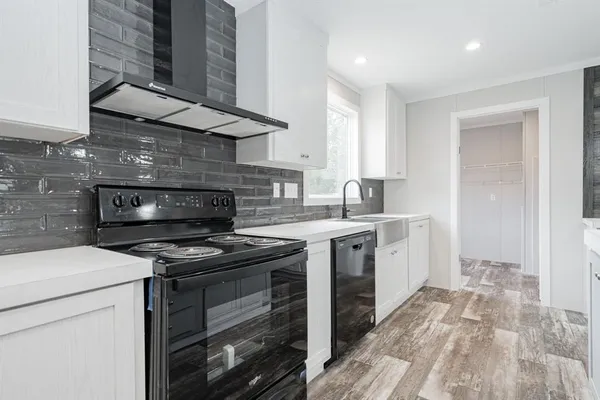 a kitchen with a stove and a sink