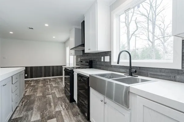 a kitchen with a sink and cabinets