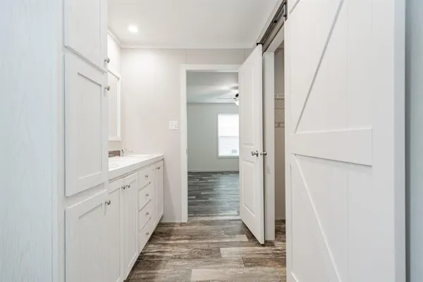 a bathroom with a sink and mirror