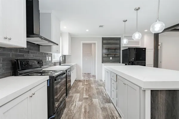 a kitchen with a stove and a sink