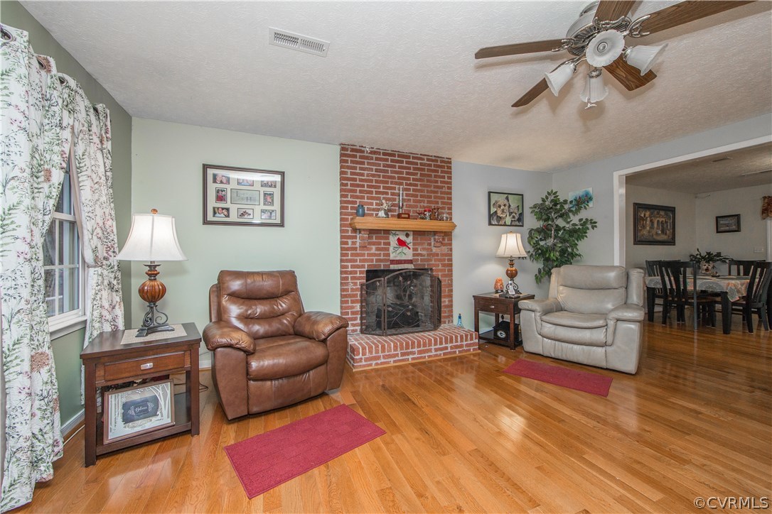 Great Room with Beautiful Hardwood Floor & Brick F