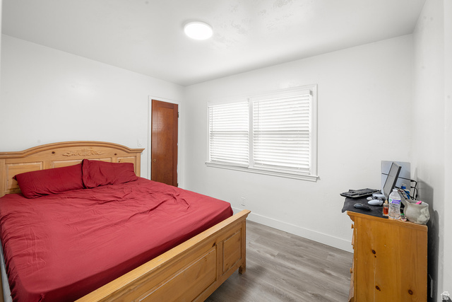 3885 West 4500 S Road Delta, UT 84624 - Photo 17 of 24 White walls, wood-finish flooring, and white window blinds