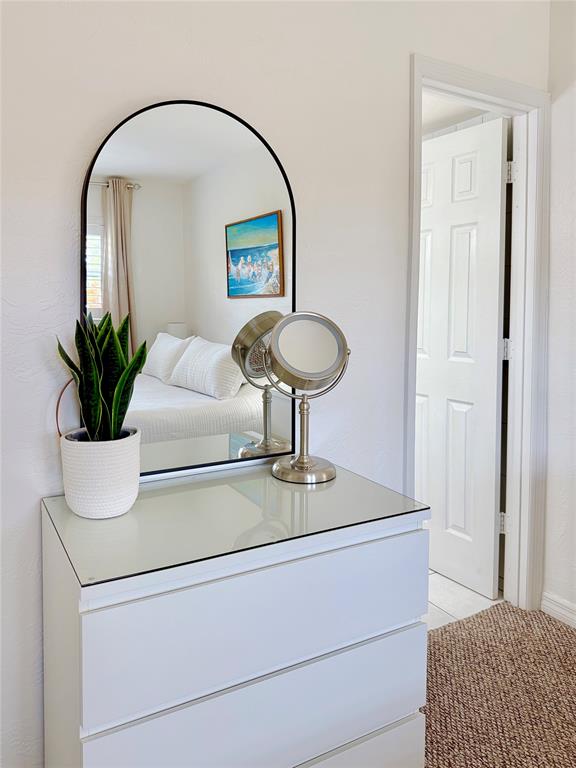 2350 Northeast 14th Street Causeway, Unit 108 Pompano Beach, FL 33062 - Photo 17 of 38 a room with a sink and a mirror