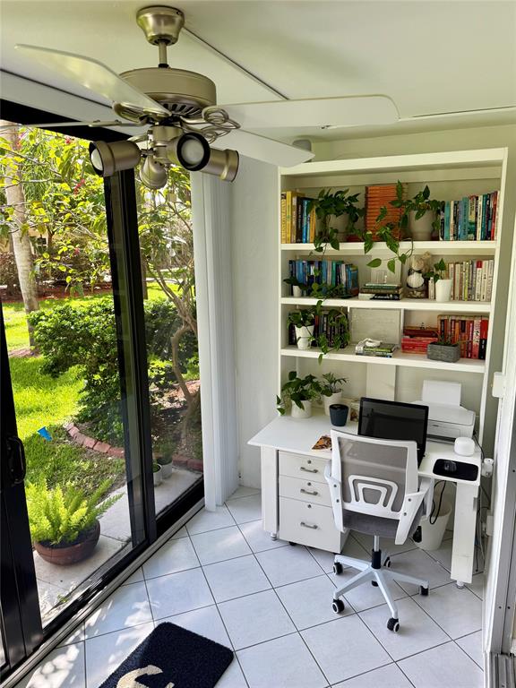 2350 Northeast 14th Street Causeway, Unit 108 Pompano Beach, FL 33062 - Photo 2 of 38 a room with furniture and a window