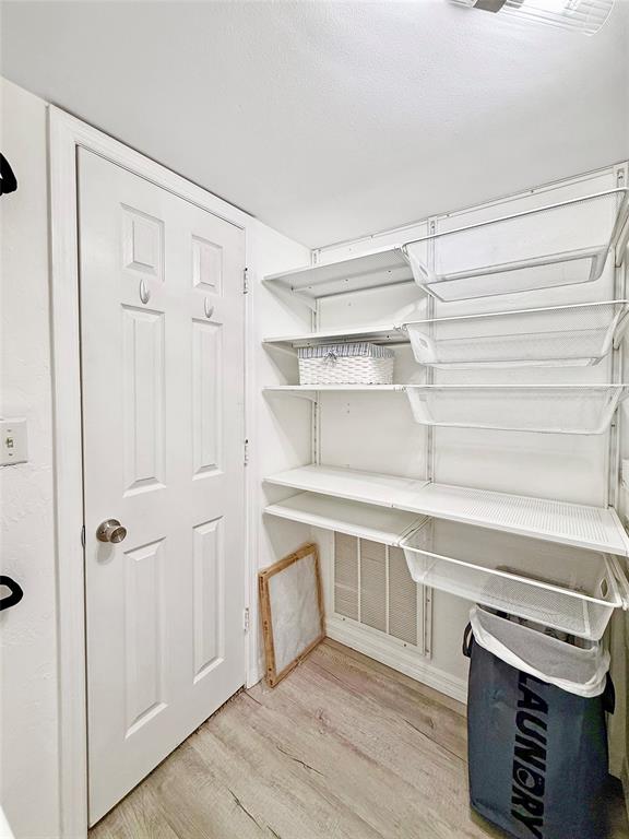 2350 Northeast 14th Street Causeway, Unit 108 Pompano Beach, FL 33062 - Photo 21 of 38 a view of a room with racks on the wall