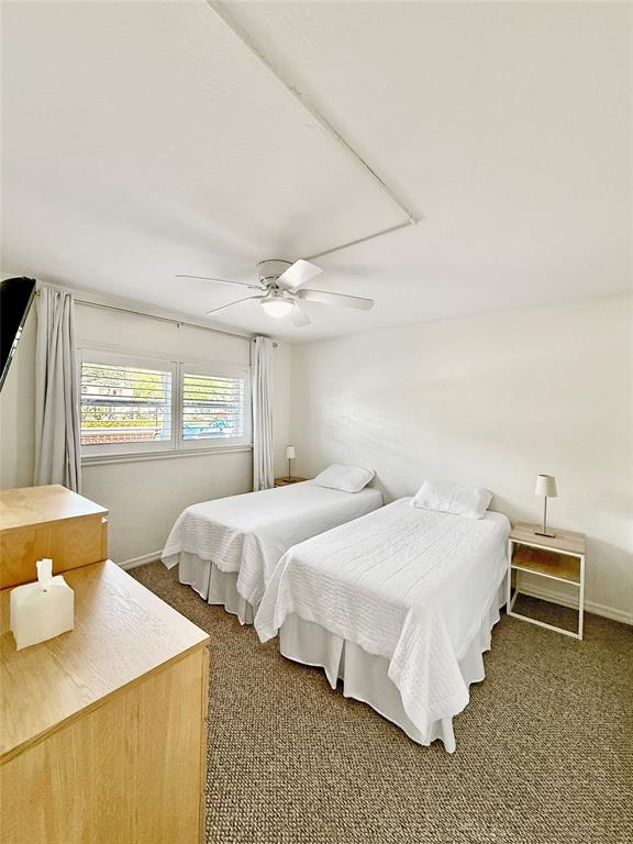 2350 Northeast 14th Street Causeway, Unit 108 Pompano Beach, FL 33062 - Photo 24 of 38 a bedroom with two beds and window