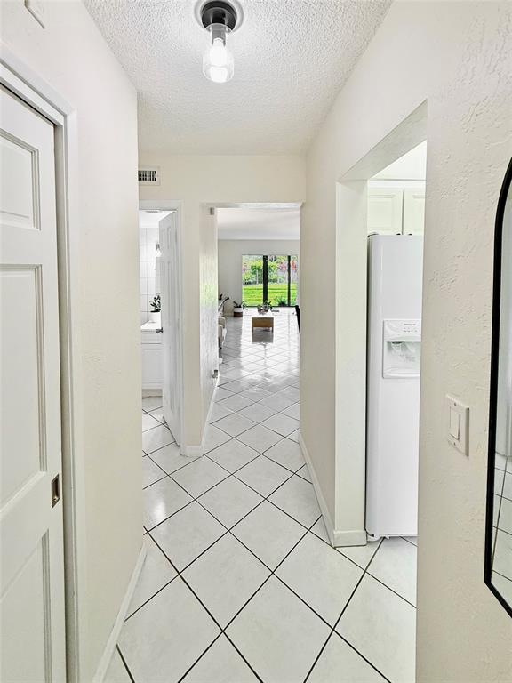 2350 Northeast 14th Street Causeway, Unit 108 Pompano Beach, FL 33062 - Photo 27 of 38 a view of a livingroom with a furniture and a window
