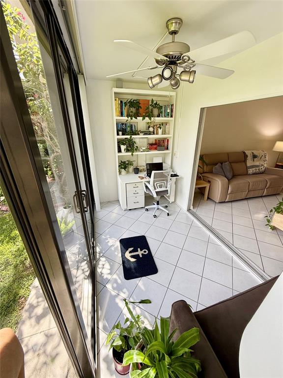 2350 Northeast 14th Street Causeway, Unit 108 Pompano Beach, FL 33062 - Photo 3 of 38 a view of living room with furniture and a floor to ceiling window