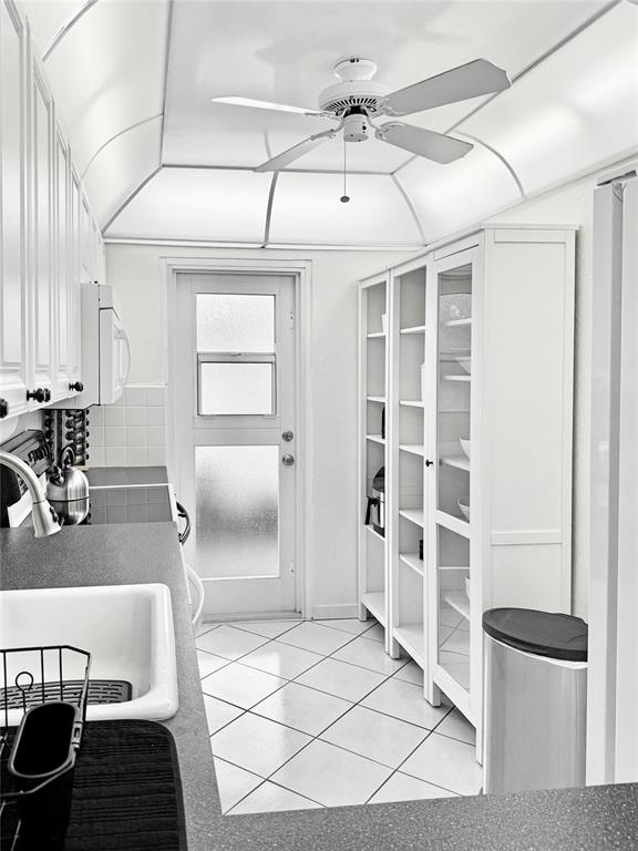 2350 Northeast 14th Street Causeway, Unit 108 Pompano Beach, FL 33062 - Photo 31 of 38 a living room with a couch and a rug