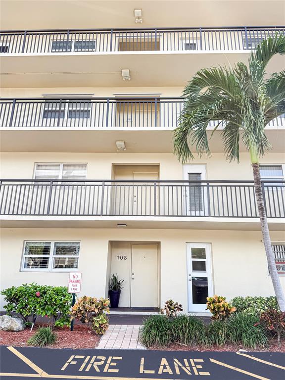 2350 Northeast 14th Street Causeway, Unit 108 Pompano Beach, FL 33062 - Photo 33 of 38 a view of a house with a deck