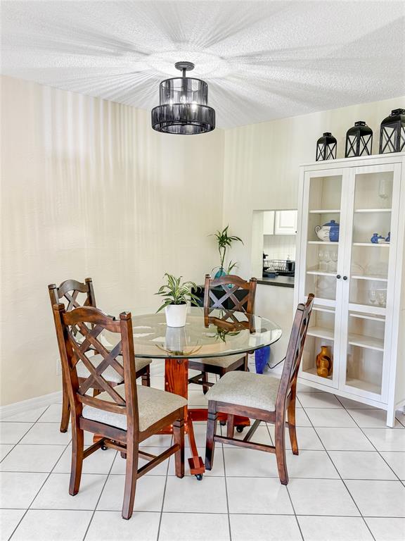 2350 Northeast 14th Street Causeway, Unit 108 Pompano Beach, FL 33062 - Photo 7 of 38 a view of a dining room with furniture