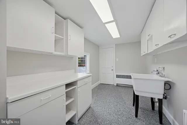 a view of cabinets and wooden floor
