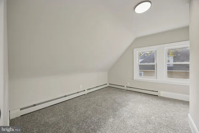 a bathroom with a toilet shower vanity and a sink