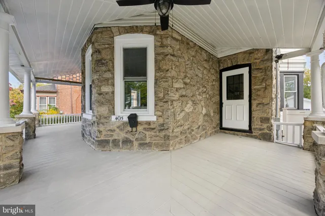 a view of a patio with table and chairs and wooden floor