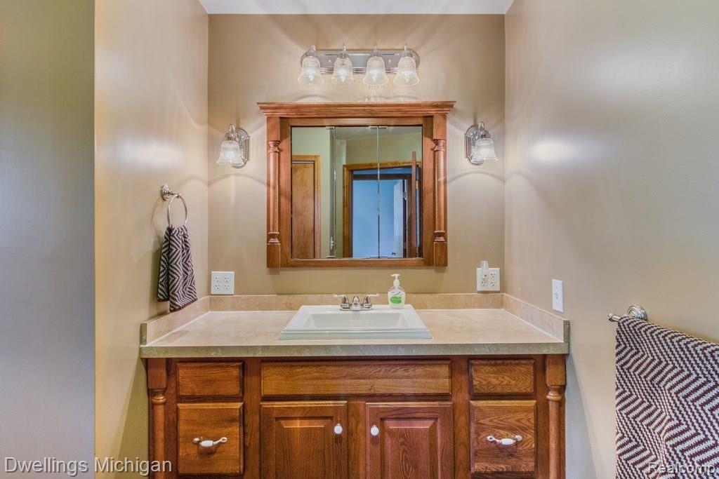 20531 Sumpter Road Belleville, MI 48111 - Photo 26 of 36 Kitchen height counter top. Looks at those light fixtures!