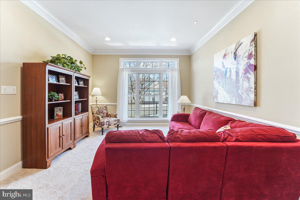 Living Rm with wall to ceiling Window