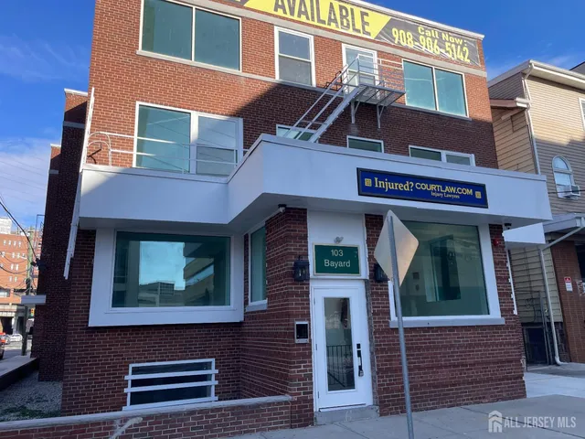 a kitchen with stainless steel appliances a stove top oven and refrigerator