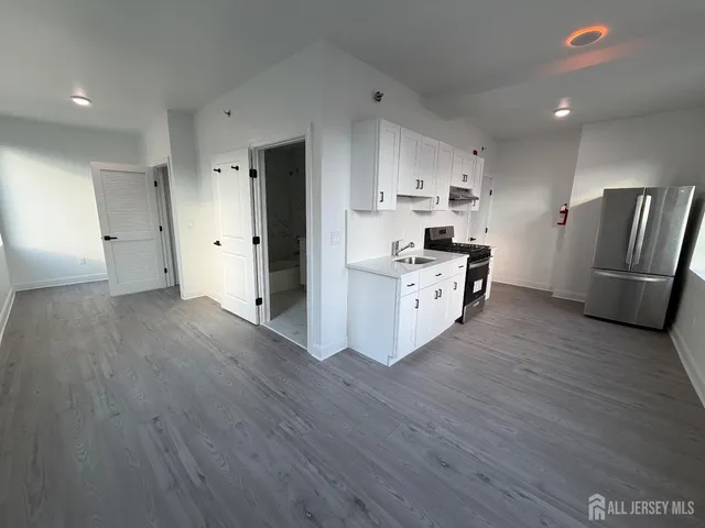 a bathroom with a toilet a sink and bathtub