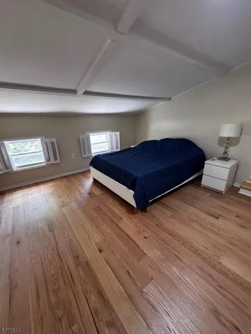 a view of a livingroom with furniture and wooden floor
