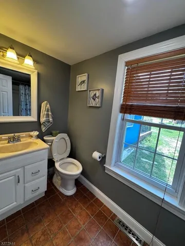 a view of a livingroom with furniture and a flat screen tv