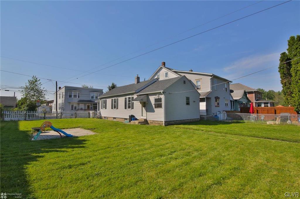 151 West 16th Street Northampton, PA 18067 - Photo 16 of 18 a house that has a big yard and large trees