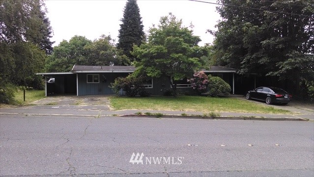 607 Sheridan Road Bremerton, WA 98310 - Photo 1 of 14 a view of a house with a yard and sitting area