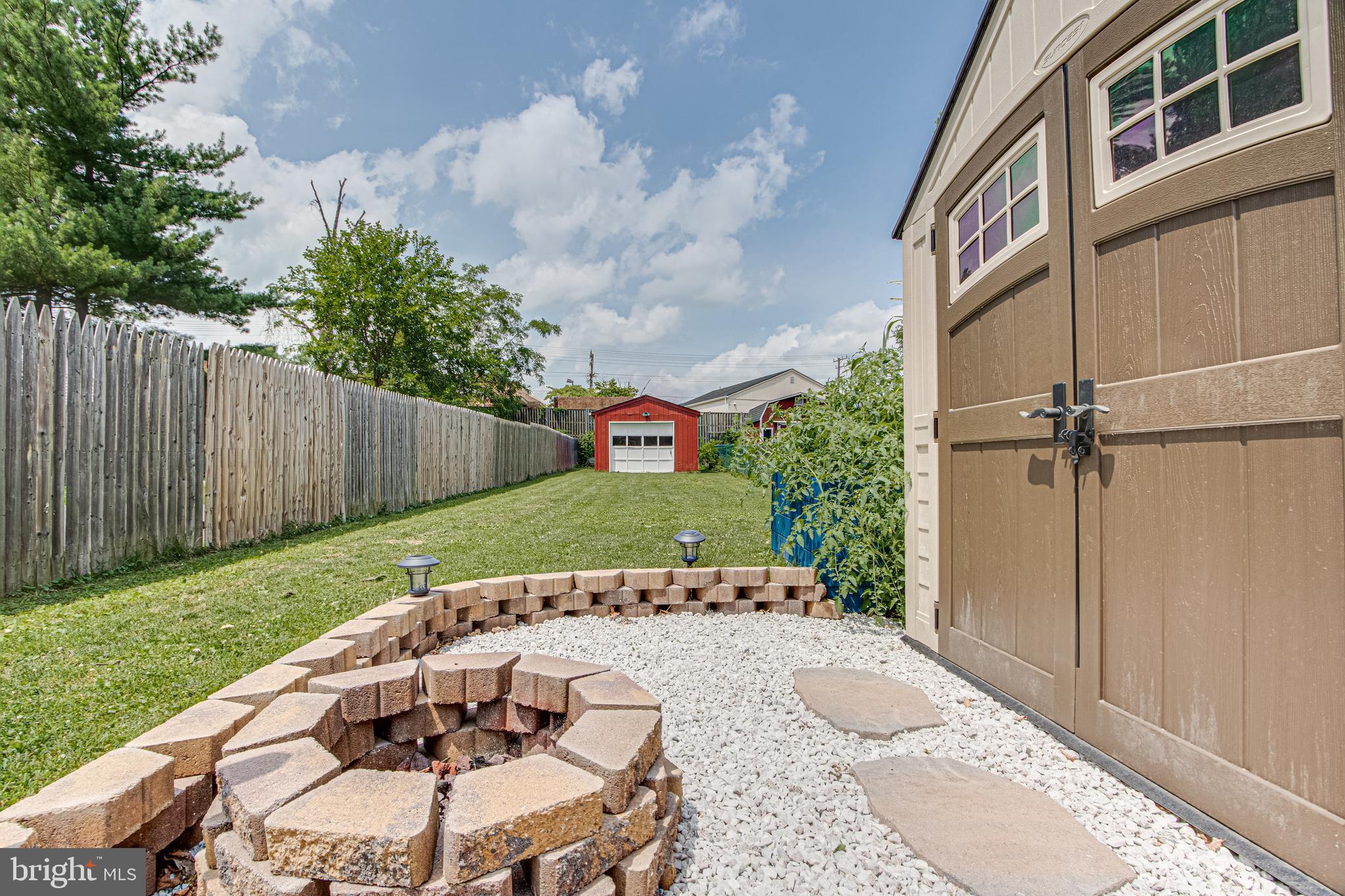 1668 Yakona Road Baltimore, MD 21286 - Photo 41 of 50 Fire pit and level grassy yard to detached garage