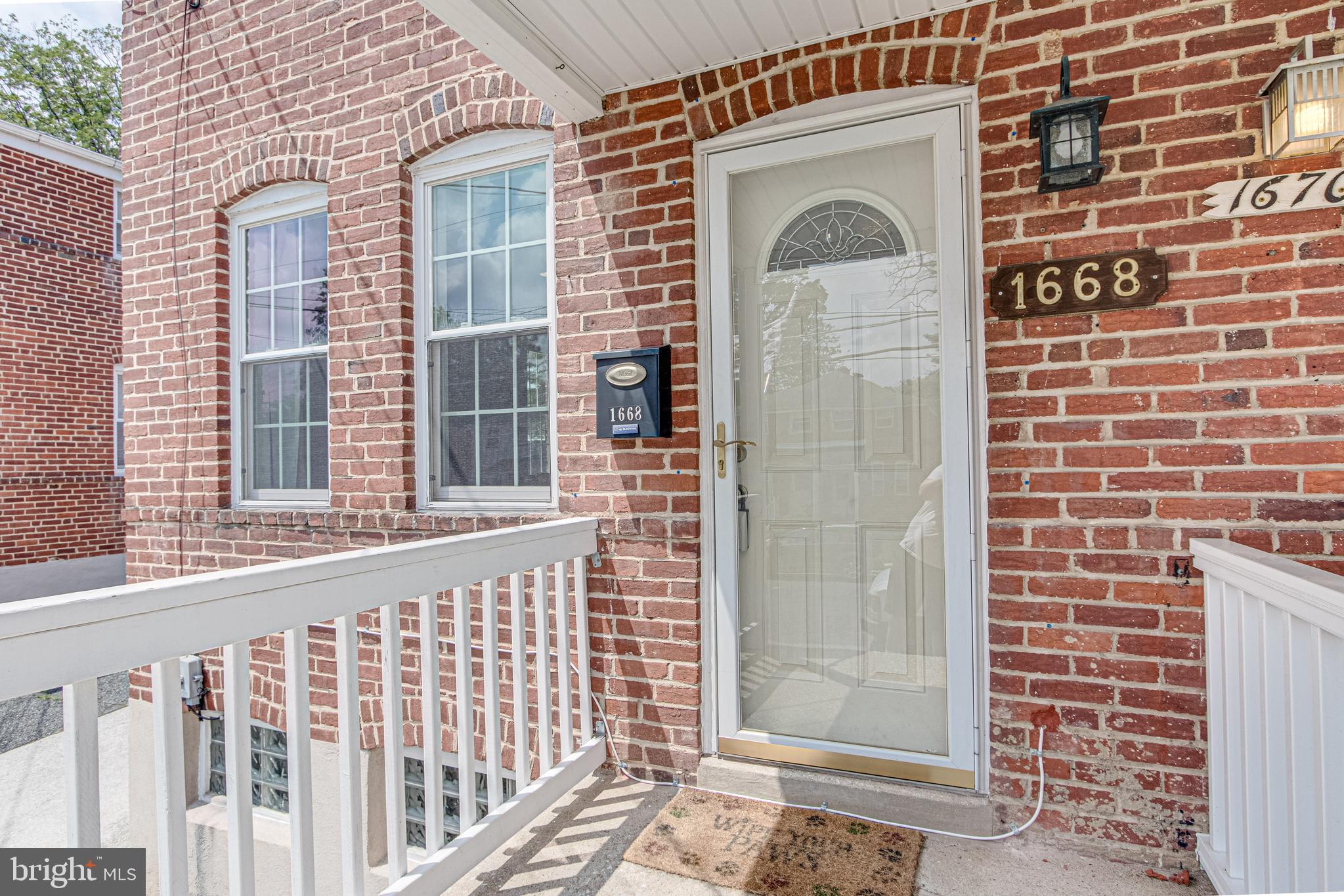 1668 Yakona Road Baltimore, MD 21286 - Photo 8 of 50 Clean porch front with white railings!