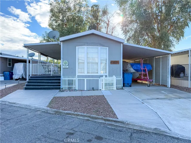 a view of a house with a yard and garage