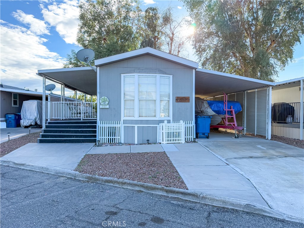 a view of a house with a yard and garage