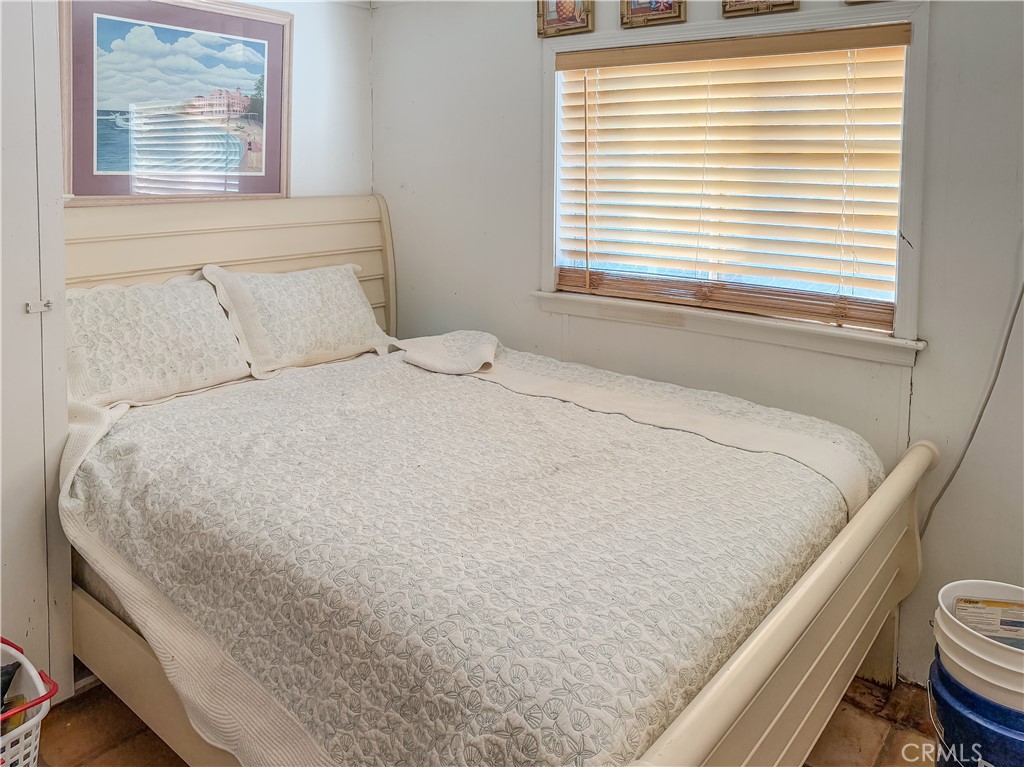 547 Channel Way Needles, CA 92363 - Photo 12 of 15 a large bed sitting in a bedroom next to a window