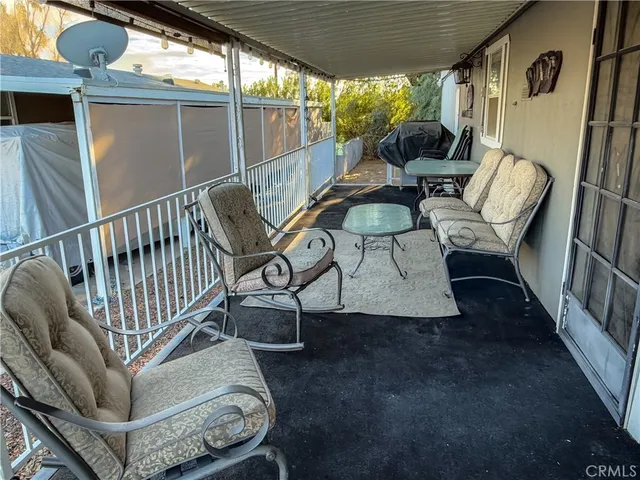 a view of balcony with furniture