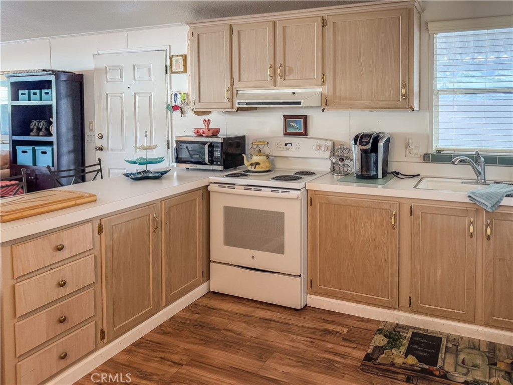 547 Channel Way Needles, CA 92363 - Photo 6 of 15 a kitchen with cabinets appliances and a counter space