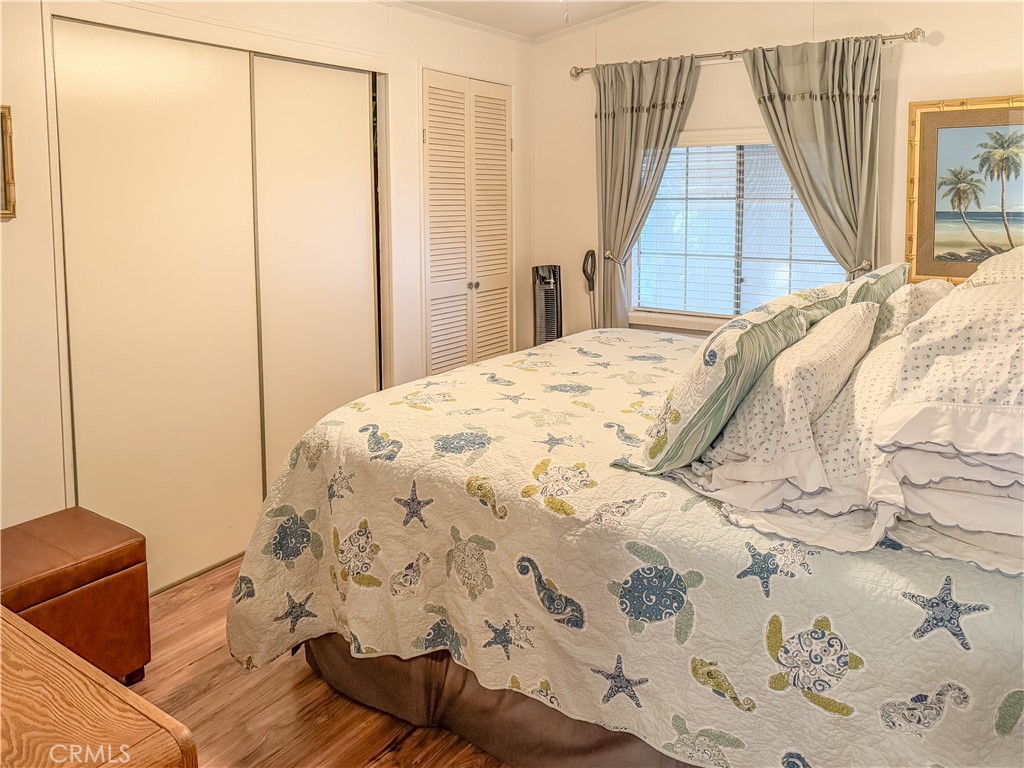 547 Channel Way Needles, CA 92363 - Photo 9 of 15 a bed sitting in a bedroom next to a window